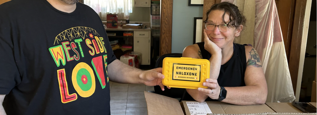 Community ourtreach workers holding a Narcan kit
