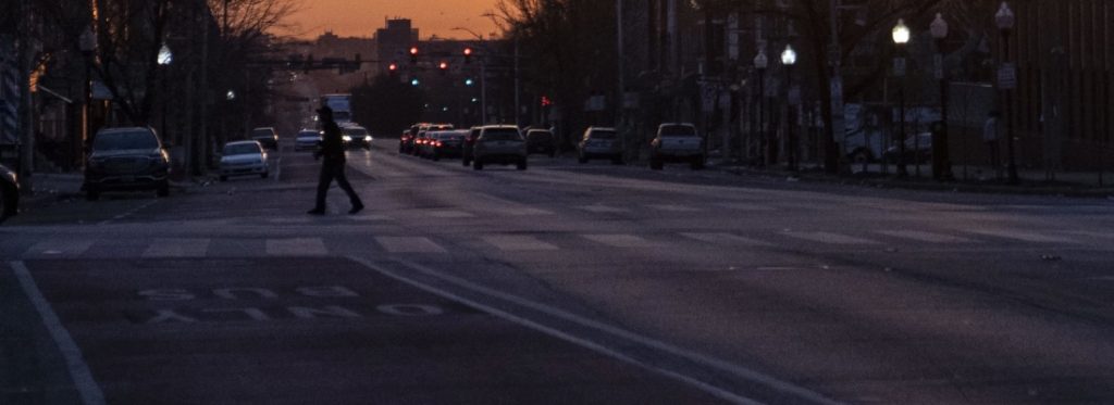 pedestrian on a dark Baltimore street
