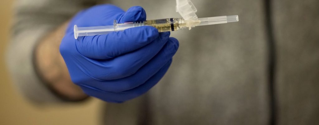 Medical provider holding a syringe with Sublocade