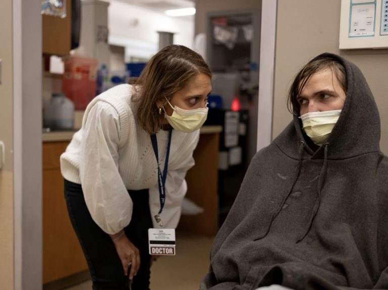 Medical staff talking to a patient