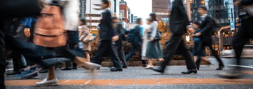 people walking to work in a city
