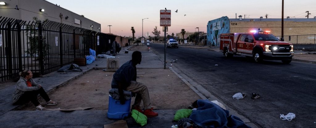 Stree scene with passing ambulance in Arizona city