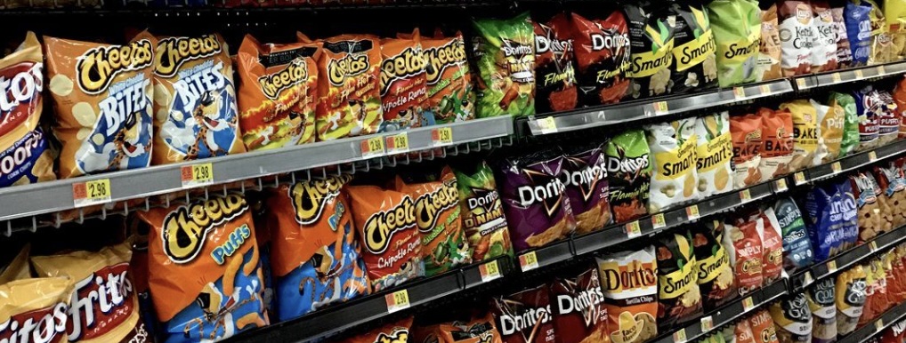 Tortilla and potato chips on a store rack